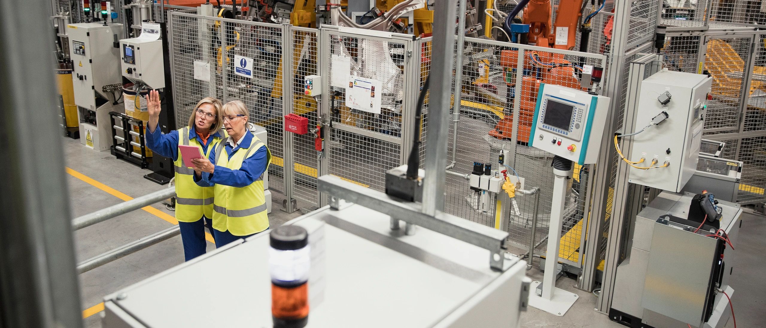 Construction workers in manufacturing facility